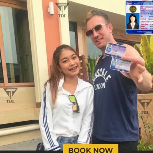 Happy couple after getting Thai driving licenses