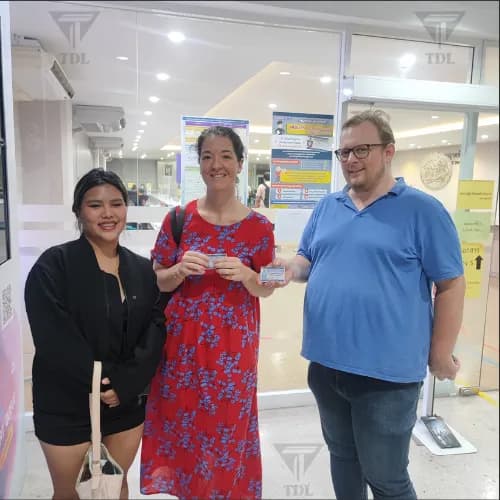 Group of clients at DLT office with new licenses