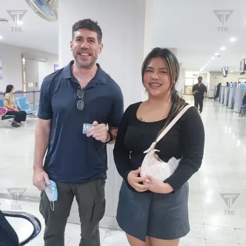 Young couple at DLT office with new licenses